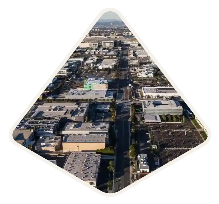 Aerial view of low-rise commercial buildings along a main boulevard in El Segundo, CA