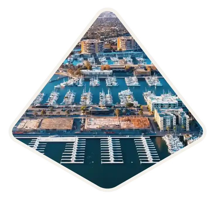 Waterfront homes and moored boats along the main channel in Marina del Rey, CA