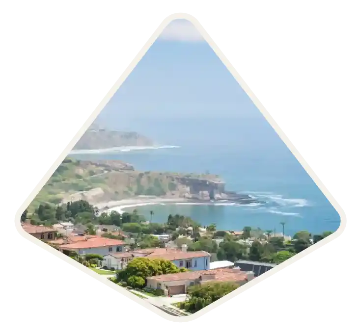 Rocky headland and cliffs above a curved cove on the coast at Palos Verdes, CA