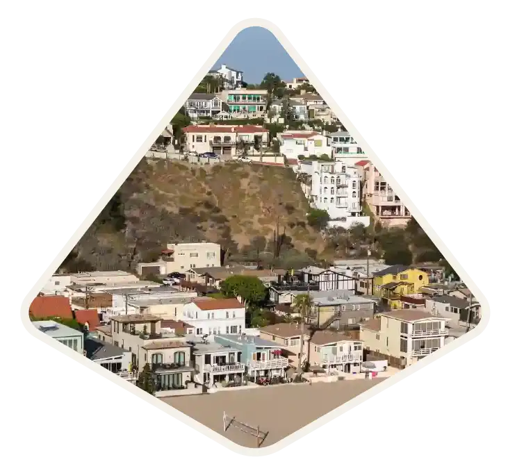 Hillside homes stacked above low-rise streets on a coastal slope in Playa Vista, CA