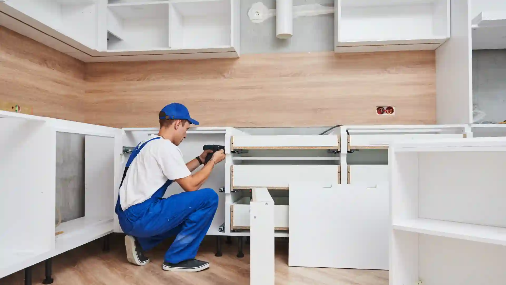 Kitchen cabinetry being installed during a full kitchen renovation
